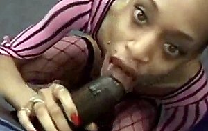 Redhead black chick gives naughty blowjob