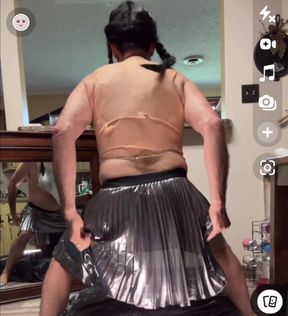 Shemale wearing see-through chainmail top shows off her nice rack