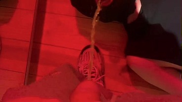 Amateur boy pissing in a glass held in his friend's mouth