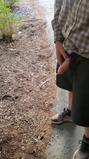 Boy Peeing Outside Cabin