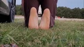 Sexy feet in wet grass