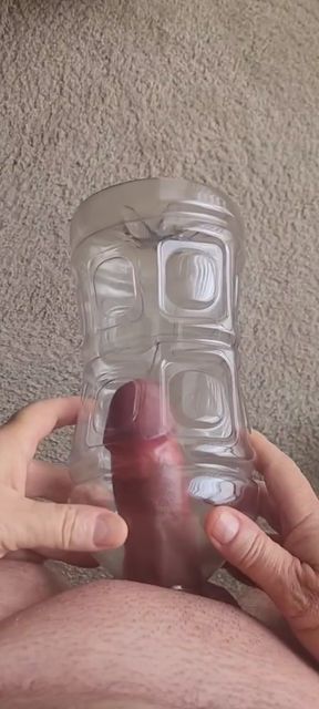 Exhibitionist masturbator demonstrates getting cock sucked by plastic bottle