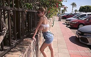 Mila amour in her overalls at the desert beach