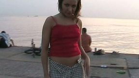 Redhead sexy Russian girl flashes her breasts and pussy on the pier