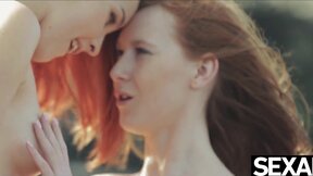 Watch these two hot redheads have wild lesbian sex on the beach