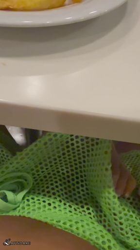 Footjob from an asian hotwife under the dining table in the buffet on