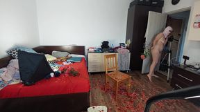 Sexy wife having fun with roses in the bedroom. Sexy wife cleans with the vacuum cleaner in the bedroom.