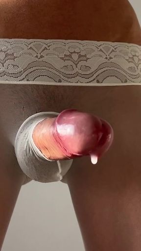 A ladyboy masturbates his large penis in white tights and cums twice at once   Clip 2
