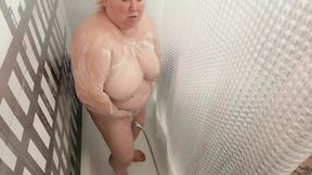 Mother-in-law takes a shower and washes her big tits