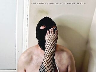 Foot Domination. Dominatrix Nika films slave giving her foot massage. Chastity belt and foot slaps