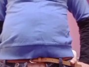 Cute crossdresser sissy boy in a skinny jeans with a dick outside from a zip.
