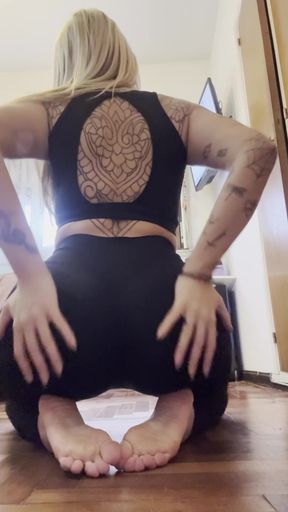 Athletic blonde amatuer does yoga in her living room