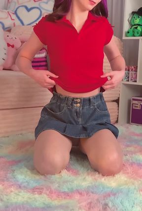 Cute girl in red shirt and denim shorts