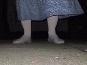 Sissy cross-dresser pissing in the garden on their own feet