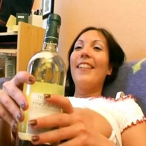 Hot German girl with big tits stuffing a bottle in her shaved pussy