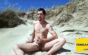 Exhibitionist Strokes Hard on the Beach