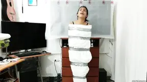 Mummified panty head prepares for bondage session