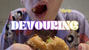 Devouring a burger