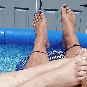 Showing off our pedicured toes in the back yard pool