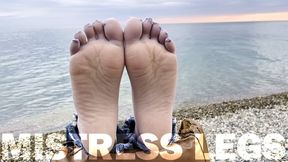 Sexy feet in gray nylon socks with separate toes teasing at the seashore (MOV HD)