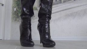 She cut the black boots with scissors and tore them with her hands d