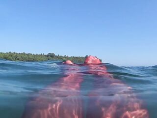 red stocking in the sea at the public beach