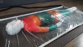 Mummification with multicolored stretch wrap in a transparent vacuum bed with vibro and orgasms