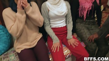 Hot ladies who are wearing head scarfs are having group sex with a very handsome guy