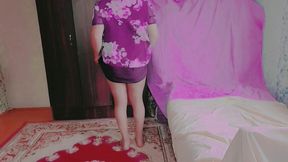 Cute femboy lifting skirt slightly under soft lights