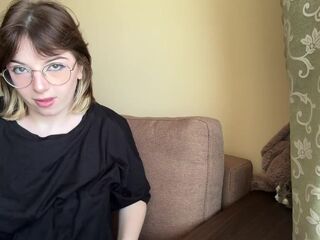 Impressive brunette hair in a t-shirt shows off her lush boobs