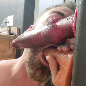 Sucking two dildos!