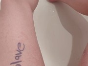 Trans boy rubbing and pissing in the bathtub