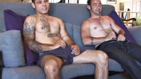 Dillon and Joe are sitting on the couch talking about how they have never done anything with another guy before. Well that's about to change. They both have their dicks out at once and Dillon is soon on his knees with Joe's in his mouth.