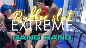 Miss Lilly and Mistress AE dominates the rubber slut extreme latex gang bang