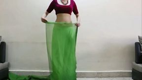 Beautiful Indian girl with sexy curvy body gives saree lesson