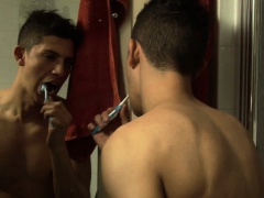 Two handsome young men explore each other's bodies with eagerness