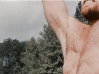 Muscled boy Kostya Kazenny warms up at the stadium, jerks off and cums