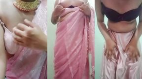 indian gay crossdresser gaurisissy pressing and playing with her big boobs looking in pink saree looking like a housewife
