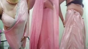 indian gay crossdresser gaurisissy pressing and playing with her big boobs looking in pink saree looking like a housewife