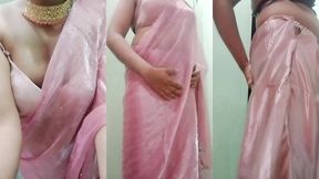 indian gay crossdresser gaurisissy pressing and playing with her big boobs looking in pink saree looking like a housewife