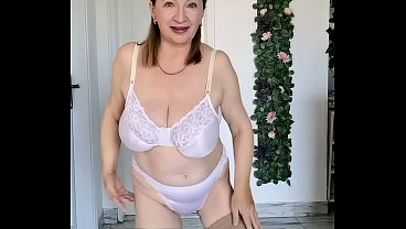 Busty GILF in white