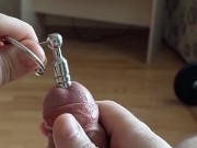 Cumshot through penis urethral plug with glans ring (slow motion cumshot)