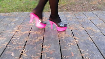 Lady L walking wirh pink mules.