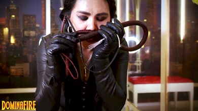 Leather-clad mistress commands the room with whip and ASMR in urban lair