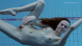 Super slender girl showing off her beauty underwater