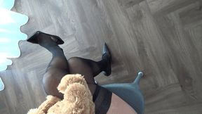 teddy bear sits astride my crossed legs 2La