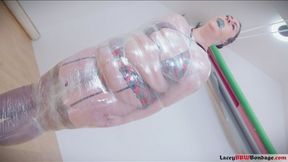 Lacey's Saran Wrap Enigma: Bound for Intense Pleasure (saran wrap, crotch bottom harness, magic wand, clear wrap gag, vibrator orgasms, flogging, bondage, mummification, restraint, pleasure, dominance, submission)