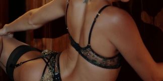 Beautiful lesbians in black lingerie playing with toys