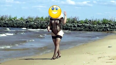 Mature Russian woman pleasures herself on a secluded sandy beach
