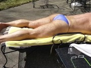 Sunning in a purple thong bikini where my neighbors can see